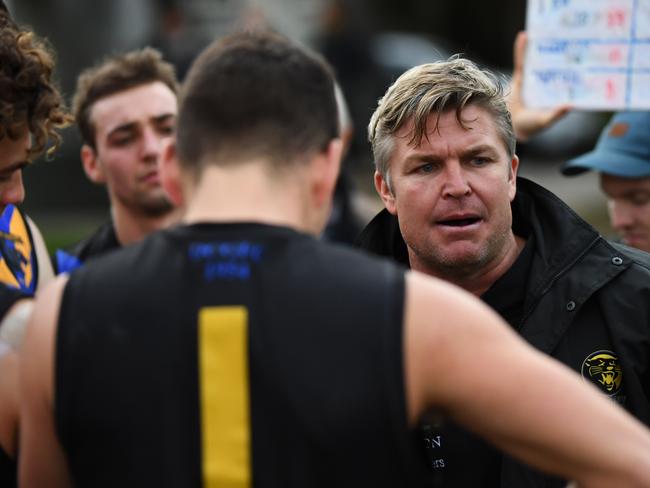 Head Coach of Carey Michael Tarrant addresses his players during the VAFA match at the Carey Sport Complex, Bulleen, Melbourne, Saturday, August 11, 2018. VAFA (Premier B): Old Carey v Beaumaris. (AAP Image/James Ross) NO ARCHIVING