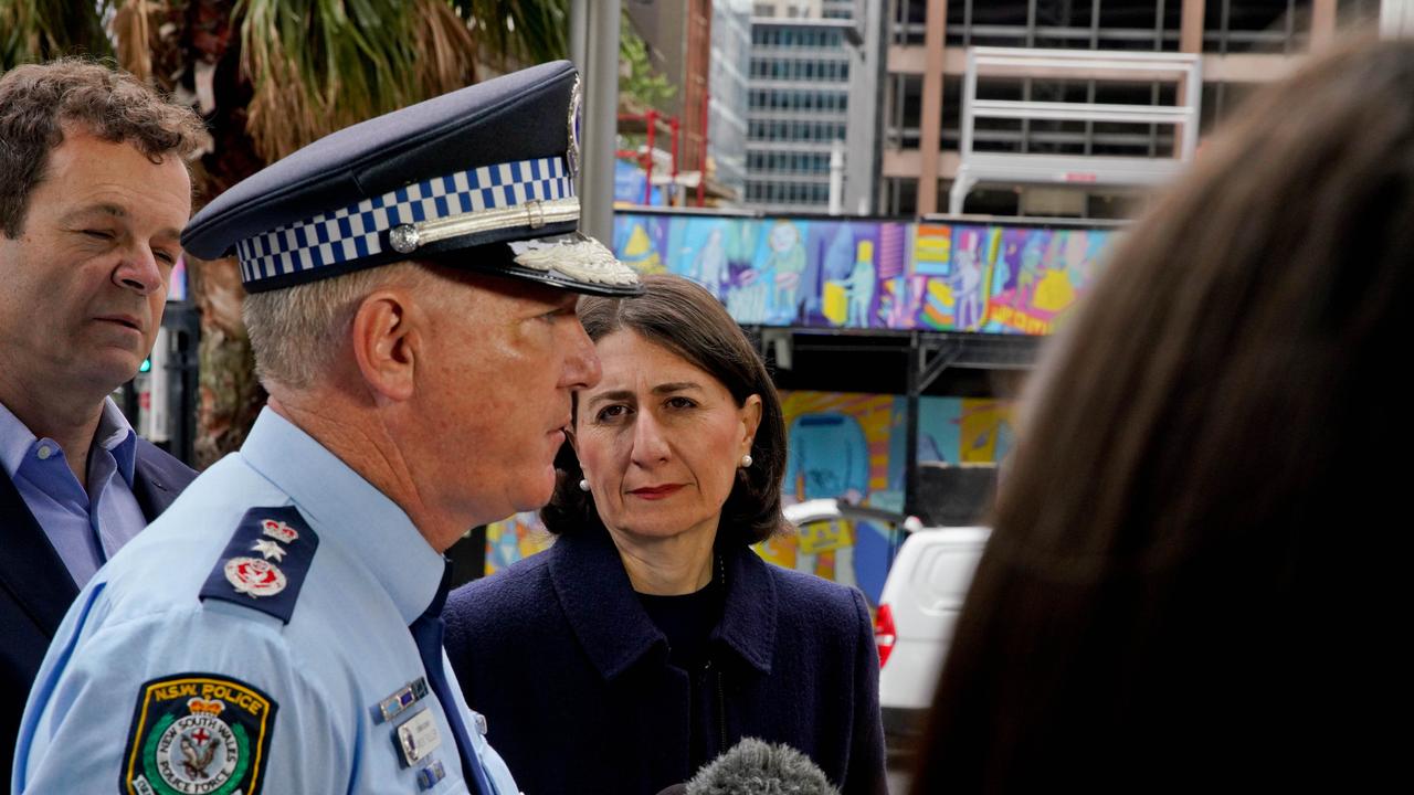 NSW Premier Gladys Berejiklian with NSW Police Commissioner Mick Fuller address the media in Sydney. Premier Gladys Berejiklian has denied she caved into bullying broadcaster Alan Jones when she intervened to allow horse racing advertising to be projected onto the sails of the Sydney Opera House. (AAP Image/Ben Rushton)