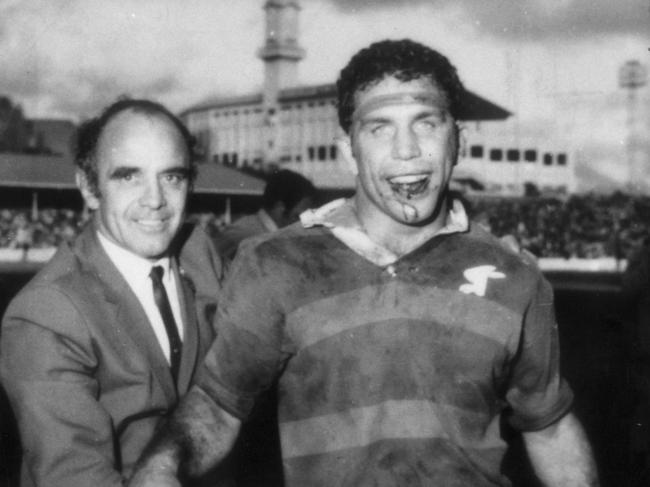 Sept 1970 : Coach Clive Churchill (L) & captain John Sattler after Souths defeated Manly in 1970 grand final at SCG PicNews/Ltd. Rugby League sport blood injuries