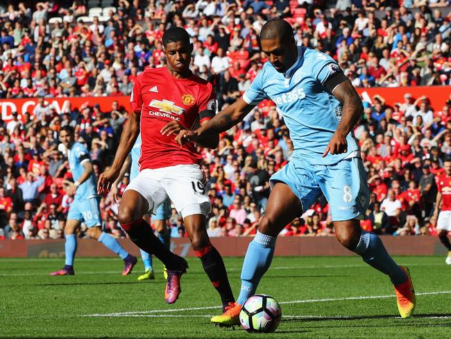 Rashford of Manchester United (L) and Glen Johnson of Stoke City (R).