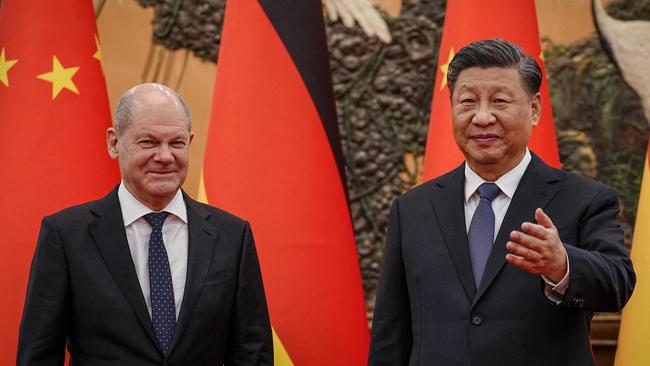 Chinese President Xi Jinping, right, welcomes German Chancelor Olaf Scholz at the Grand Hall in Beijing. Picture: AFP