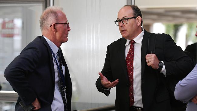 Acting CEO Joe McCabe and Infrastructure and operations director Matt Richardson speak outside the council meeting during confidential discussions. Picture: Shae Beplate.