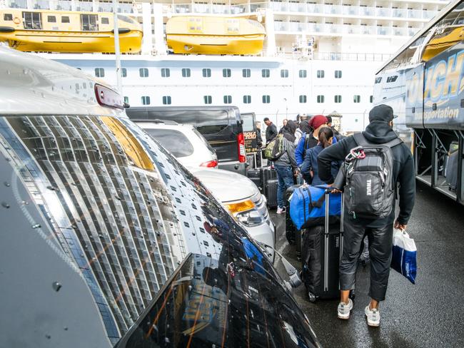 People exit the port after being aboard of Royal Caribbean Cruise Ship Anthem of the Seas. At least two dozen Chinese citizens aboard of Royal Caribbean cruise were screened for coronavirus, and four were taken to a nearby hospital. Picture: Getty