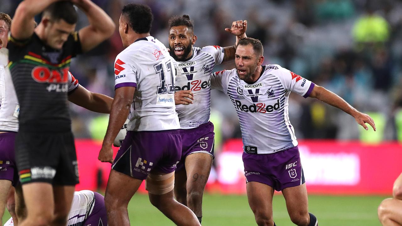 Cameron Smith and Josh Addo-Carr of the Storm celebrate victory.