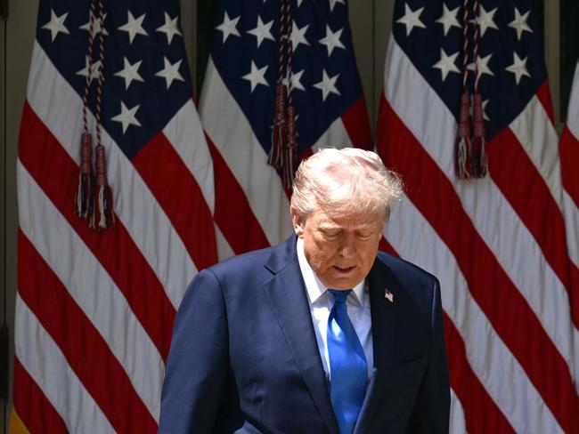 TOPSHOT - US President Donald Trump arrives to speak at a National Day of Prayer event in the Rose Garden of the White House in Washington, DC, on May 1, 2025. (Photo by Mandel NGAN / AFP)