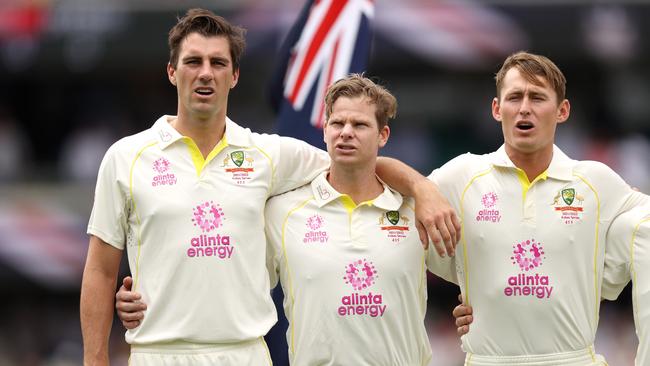 Pat Cummins sings the anthem with vice-captain Steve Smith and batter Marnus Labuschagne.