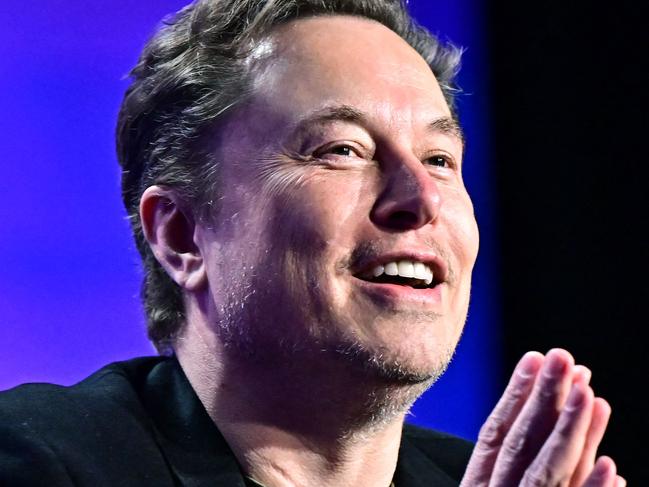 (FILES) Tesla CEO Elon Musk speaks at the 27th annual Milken Institute Global Conference at the Beverly Hilton in Los Angeles on May 6, 2024. Donald Trump announced Nvember 12, 2024 that the world's richest man, Elon Musk, will lead a new US government efficiency group tasked with cutting federal waste, as the Republican president-elect added a series of seasoned figures and hardliners to his incoming administration. Musk became a key ally to Trump during his campaign, reportedly spending over $100 million to help the Republican win and repeatedly boosting Trump's candidacy on X, the platform he owns. (Photo by Frederic J. BROWN / AFP)