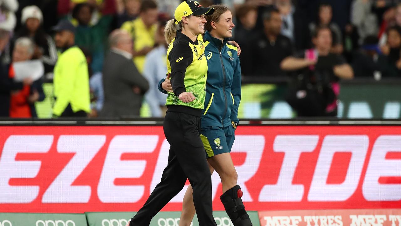 Ellyse Perry of Australia and Tayla Vlaeminck after the 2020 Women’s T20 World Cup final at the MCG. Photo by Cameron Spencer/Getty Images