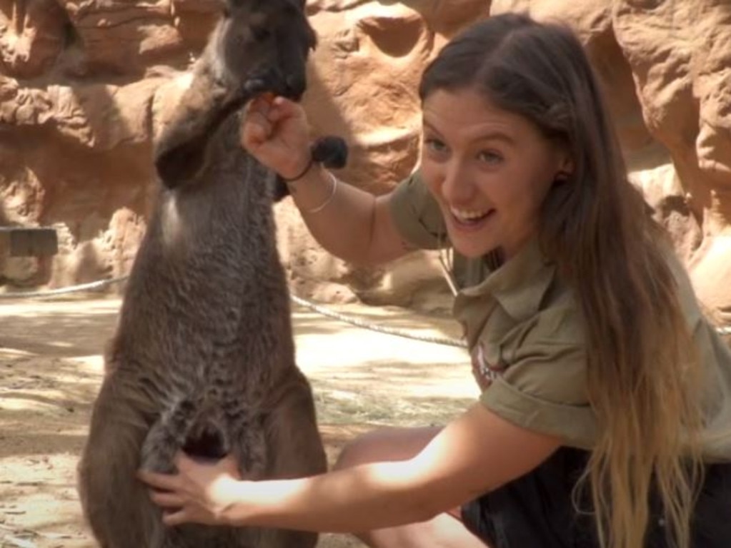 Ms Kelly opening a kangaroo's pouch.