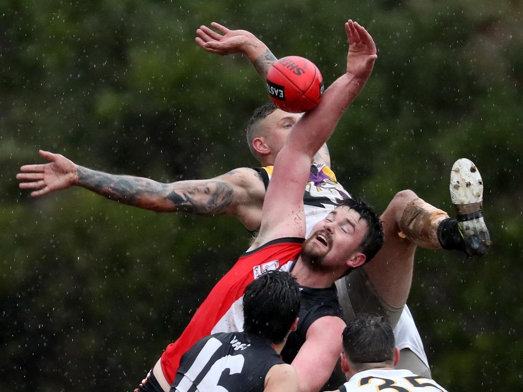 North Ringwood’s Matthew Cullinan wins a hit out.