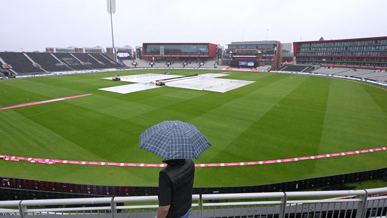 The covers are on as rain falls. Photo by Stu Forster/Getty Images