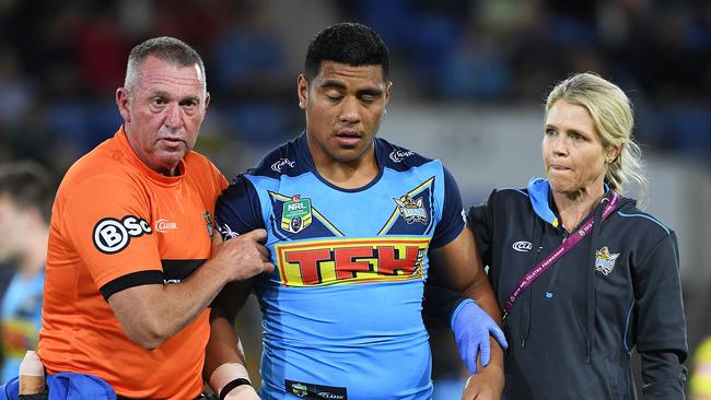 Moeaki Fotuaika is taken from the field for a concussion test. Picture: AAP/Dave Hunt