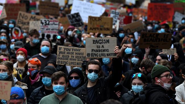 Protesters march along Bourke St. Picture: AAP