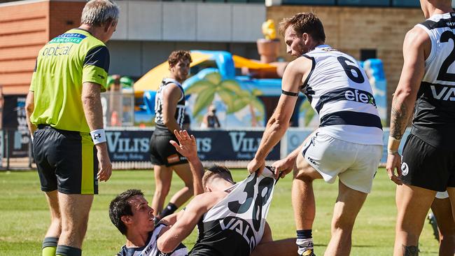 The Panthers’ Jake Summerton and Port's Peter Ladhams getting pulled off the ball by South's Brad Crabb. Picture: Matt Loxton