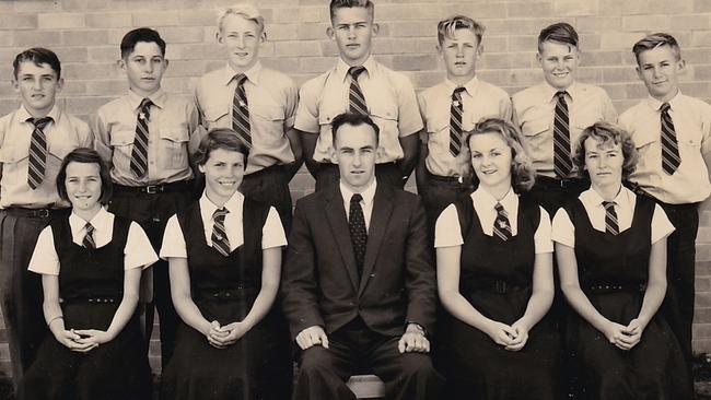 The first Sandgate District State High School swimming team in 1959: (back from left) J Bacon, P Millwater, G Peters, F Stevenson, R Garrick, S Twible, N Waters with (front from left) R Watson, L Roach, coach Mr A Faragher, J Davidson and P Ashley.