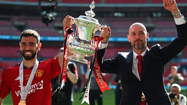 LONDON, ENGLAND - MAY 25: Bruno Fernandes of Manchester United and Erik ten Hag, Manager of Manchester United, celebrate with the Emirates FA Cup Trophy after their team's victory in the Emirates FA Cup Final match between Manchester City and Manchester United at Wembley Stadium on May 25, 2024 in London, England. (Photo by Mike Hewitt/Getty Images)