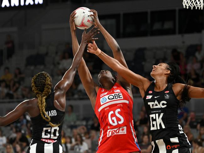 Jodi Ann Ward (L) and Geva Mentor (R) of the Magpies compete with Romelda Aiken-George of the Swifts during the round one Super Netball match between Collingwood Magpies and NSW Swifts. Picture: Getty Images