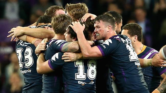 Storm players celebrate their preliminary final win over the Sharks at AAMI Park. Picture: Getty Images