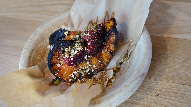 A handful of pepitas and segments of sweet-sharp blood orange, on roasted pumpkin. Picture: Nicki Connolly