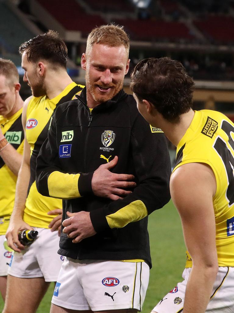 Vlaustin holds his ribs after the game. Picture: AFL Photos/Getty Images