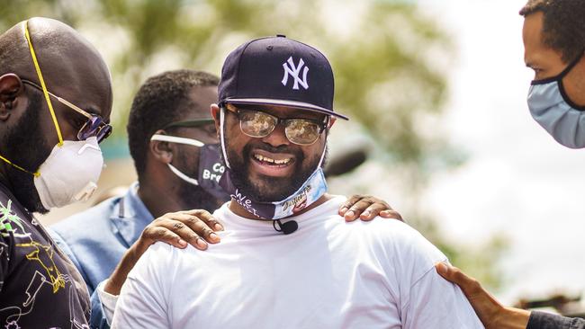 Terrence Floyd is consoled at the site in Minneapolis where his brother, George, was killed last week. Picture: AFP