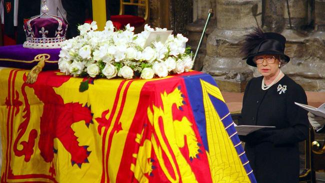 Queen Elizabeth II stands in front of the coffin of her mother, during the funeral service at Westminster Abbey in 2002. Picture: Ben Curtis / PA /WPA POOL / AFP