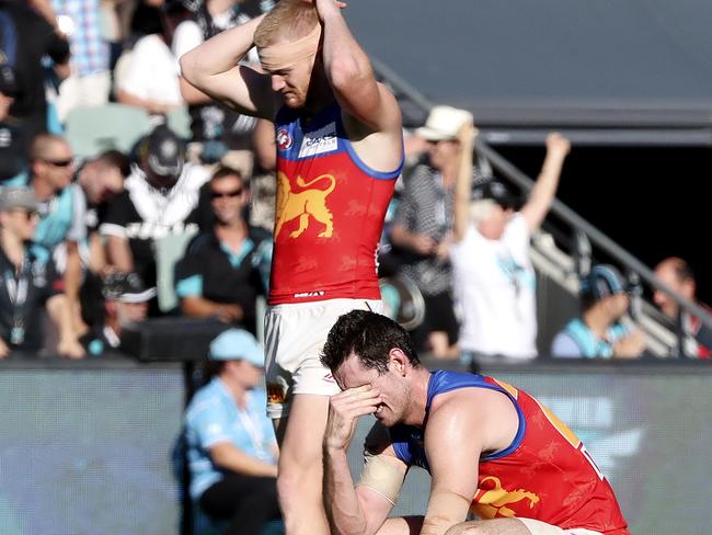 Nick Robertson and Darcy Gardiner feel the pain of the Lions’ close loss. Picture: SARAH REED