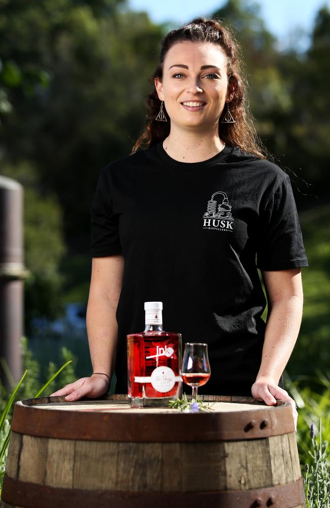 Husk Distillery's Kristyn Baker with a bottle of the new Ink Sloe &amp; Berry Gin.