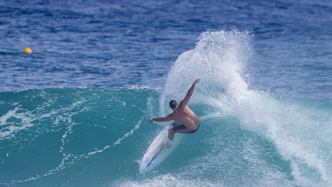 Surfers enjoying the larger swell at Snapper Rocks on Sunday 2 January 2022. Picture: Jerad Williams