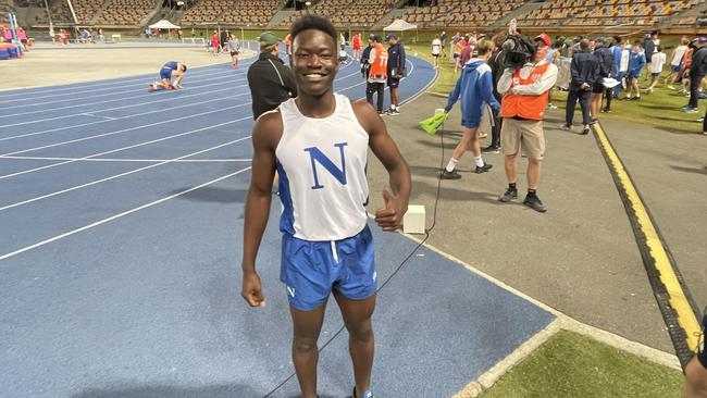 Nudgee James Swao beams after his 400m win.