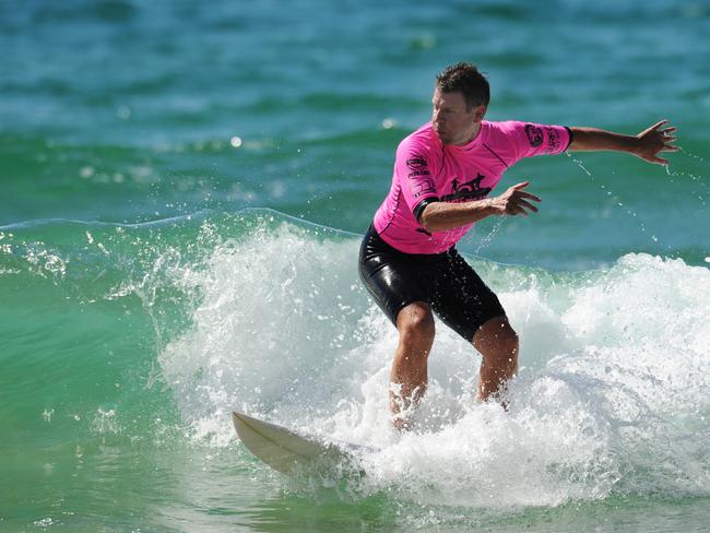 The Premier’s office clarified that the shark did give Mr Baird’s board a good whack, but did not knock him into the water / Picture: Virginia Young