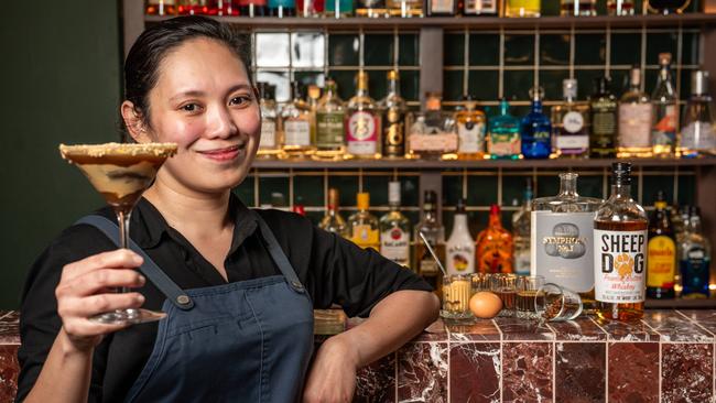 Bar manager Kay Butal at Thai Room with Adelaide's most expensive cocktail, the "Royal Thai Lark Martini". Picture: Naomi Jellicoe