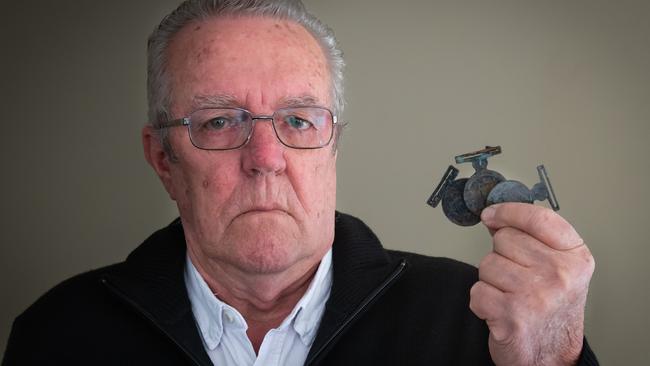 Kevin Perry with his Emergency Services Medal, recovered from the ashes of his Sarsfield home.