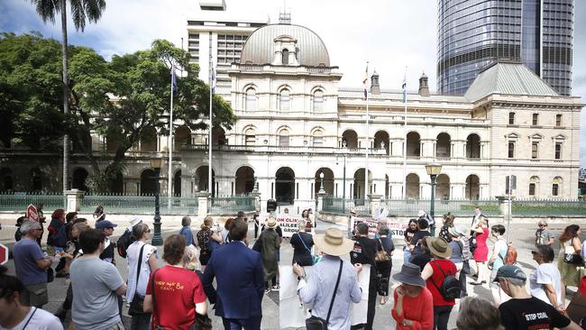 Protesters arrived early at Parliament House ahead of this morning’s public hearing. Picture: AAP/Josh Woning