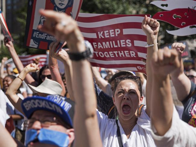 Activists shout during the rally to protest the Trump administration's immigration policies Saturday, June 30, 2018, in New York, New York. Picture: AP Photo/Kevin Hagen