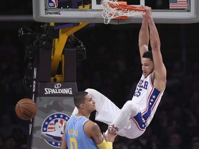 Ben Simmons dunks over Los Angeles Lakers forward Kyle Kuzma.