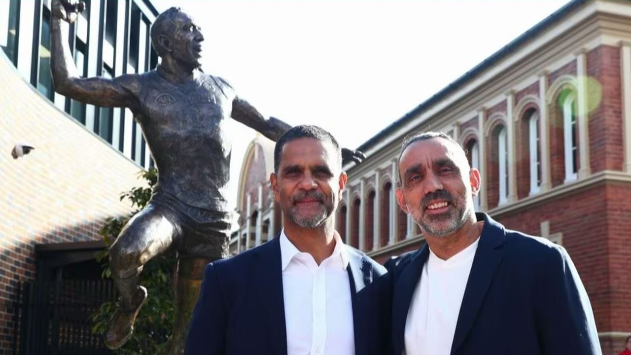 Adam Goodes and close friend and fellow Swans legend Michael O’Loughlin with the statue of the dual Brownlow medallist at Moore Park. Picture: Sydney Swans