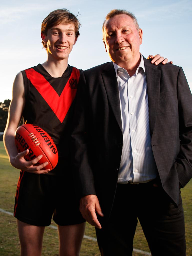 Norwood young Max Michalanney with his dad Jim, who played in four SANFL flags for the Redlegs. Picture Matt Turner.