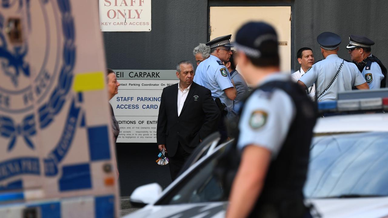 The police officers were helped by Taronga Zoo staff in their search for the monkeys. (AAP Image/Joel Carrett)