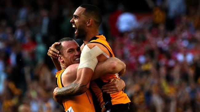 Shaun Burgoyne gets a hug from Jarryd Roughead after kicking a goal during the 2014 Grand Final. Picture: Mark Dadswell