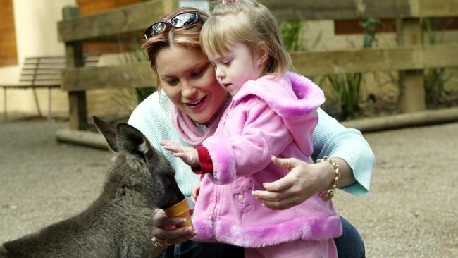 Parys Lewis, 2, with her mum Shelby Ingram and Kelly the Kangaroo on May 19, 2005. Picture: Rohan Kelly