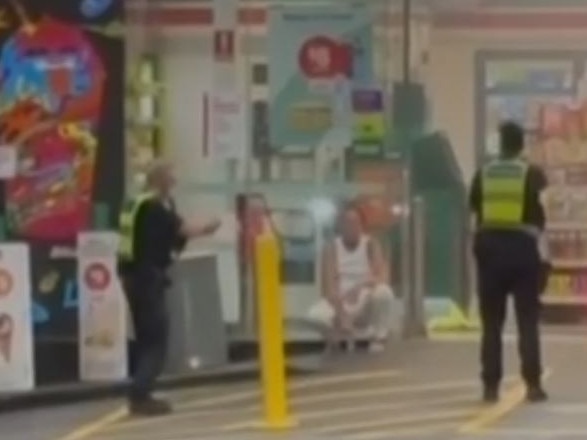 Police order the woman to ‘get on the ground’ before hitting her. Picture: 7News