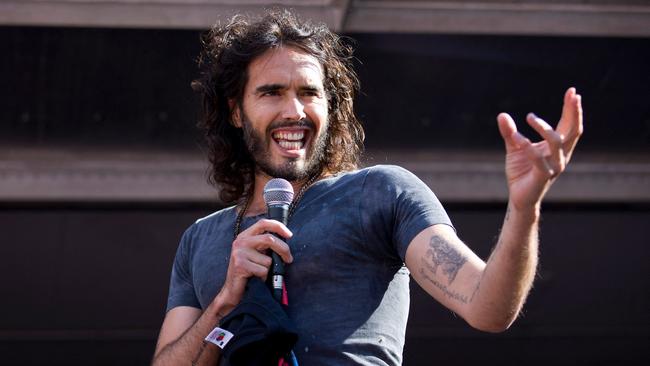 Russell Brand in 2014. Photo by Justin TALLIS / AFP