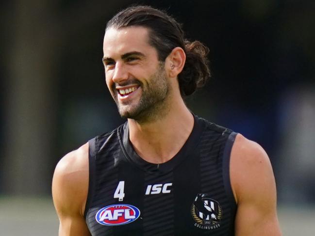 Brodie Grundy of the Magpies runs with the ball during an AFL Collingwood Football Club training session at Gosch's Paddock in Melbourne, Wednesday, March 18, 2020. (AAP Image/Scott Barbour) NO ARCHIVING