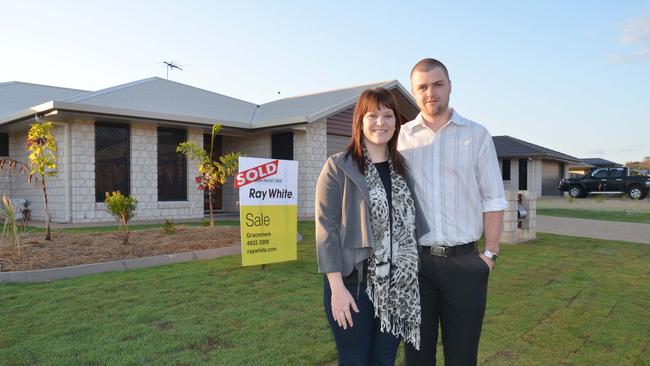 Angela Jones and Cameron Saunders outside their Gracemere home. The town attracts many residents who commute to nearby Rockhampton. Picture: Murray Ware