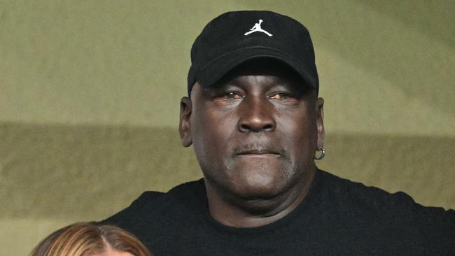 US former basketball player Michael Jordan (C) attends the UEFA Champions League 1st round day 1 football match between AS Monaco and FC Barcelona at the Louis II Stadium in the Principality of Monaco on September 19, 2024. (Photo by Miguel MEDINA / AFP)