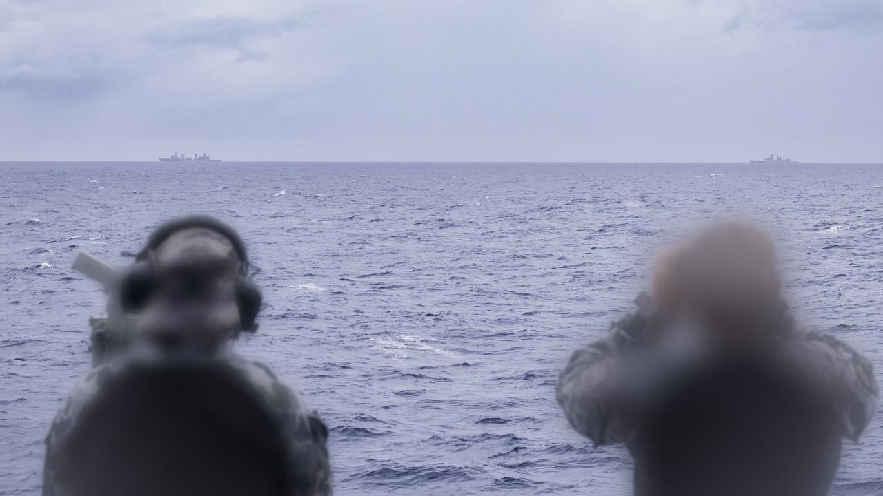 Royal Australian Navy sailors on HMAS Arunta keeping watch on People's Liberation Army-Navy (PLA-N) Fuchi-class replenishment vessel Weishanhu and Jiangkai-class frigate Hengyang in the Tasman Sea.