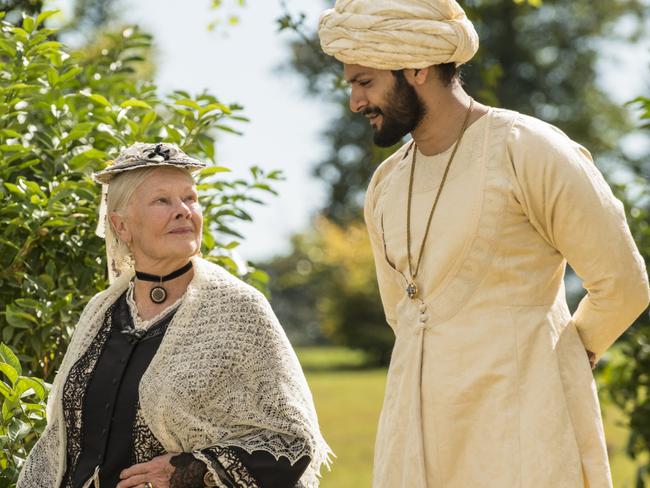 Judi Dench (as Queen Victoria) and Ali Fazal (as Abdul Karim) in a scene from film Victoria and Abdul