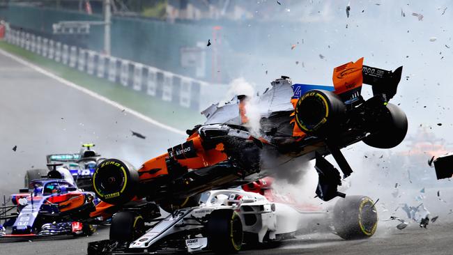 SPA, BELGIUM - AUGUST 26: Fernando Alonso of Spain driving the (14) McLaren F1 Team MCL33 Renault launches over the top of Charles Leclerc of Monaco driving the (16) Alfa Romeo Sauber F1 Team C37 Ferrari at the start during the Formula One Grand Prix of Belgium at Circuit de Spa-Francorchamps on August 26, 2018 in Spa, Belgium.  (Photo by Mark Thompson/Getty Images) ***BESTPIX***