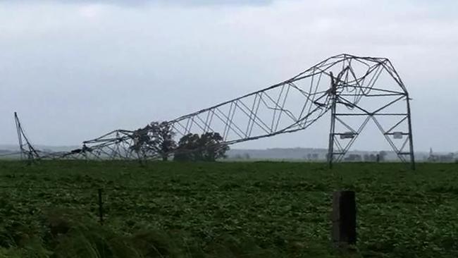 An electricity transmission tower toppled during high winds ahead of the statewide blackout in September, 2016. AFP photo: Debbie Prosser.